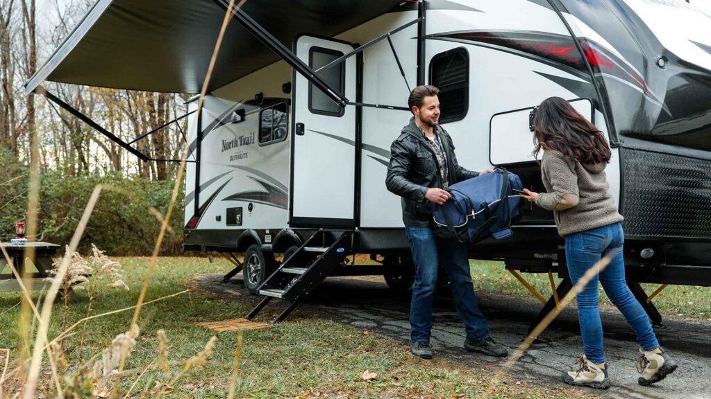 Couple setting up Caravan