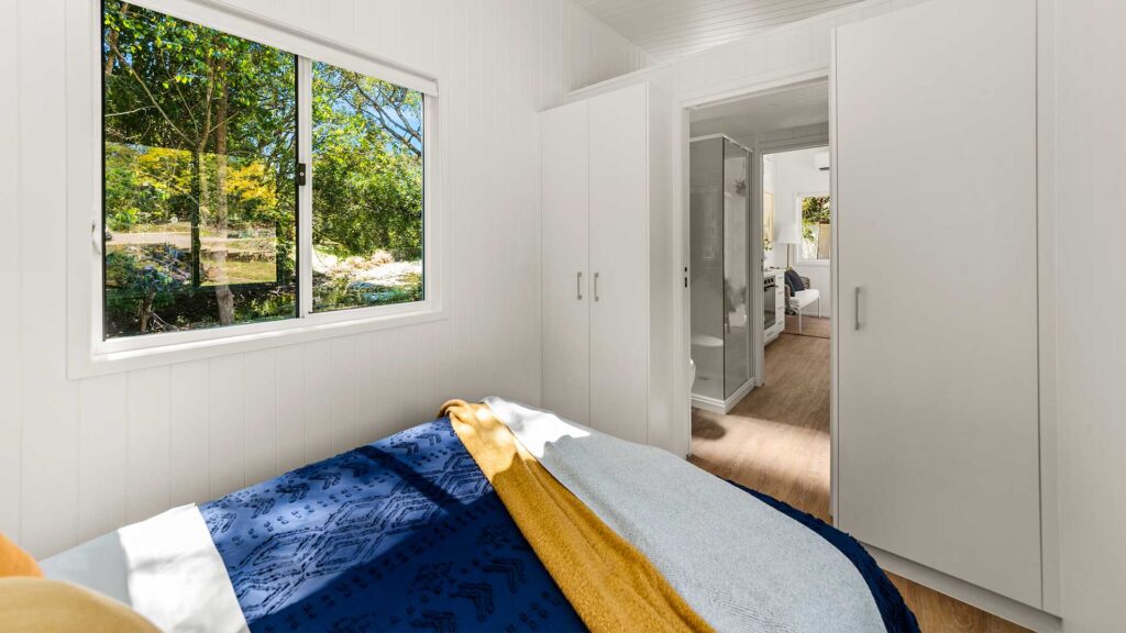 Tiny House Bedroom with wall-mounted wardrobes